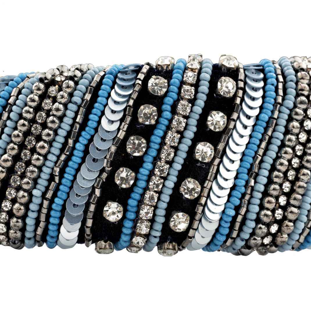 Set of beaded bracelets with blue, black, and silver beads on a white background