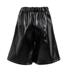 Black shiny faux-leather shorts with an elastic gathered waistband, shown against a plain white background.