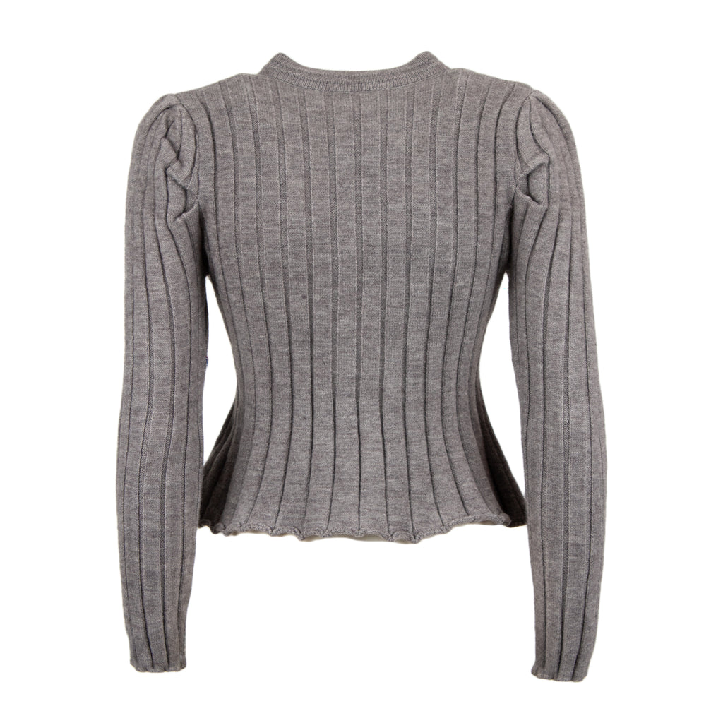 A gray ribbed knit long-sleeve top with structured shoulders and a cropped, slightly asymmetrical hem, shown against a plain white background.