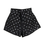 Black high-waisted shorts embellished with silver rhinestone studs, shown against a plain white background.