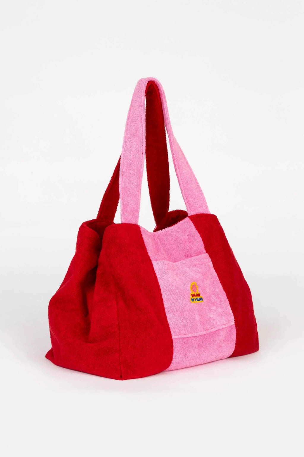 Red and pink tote bag with a visible brand logo on a white background