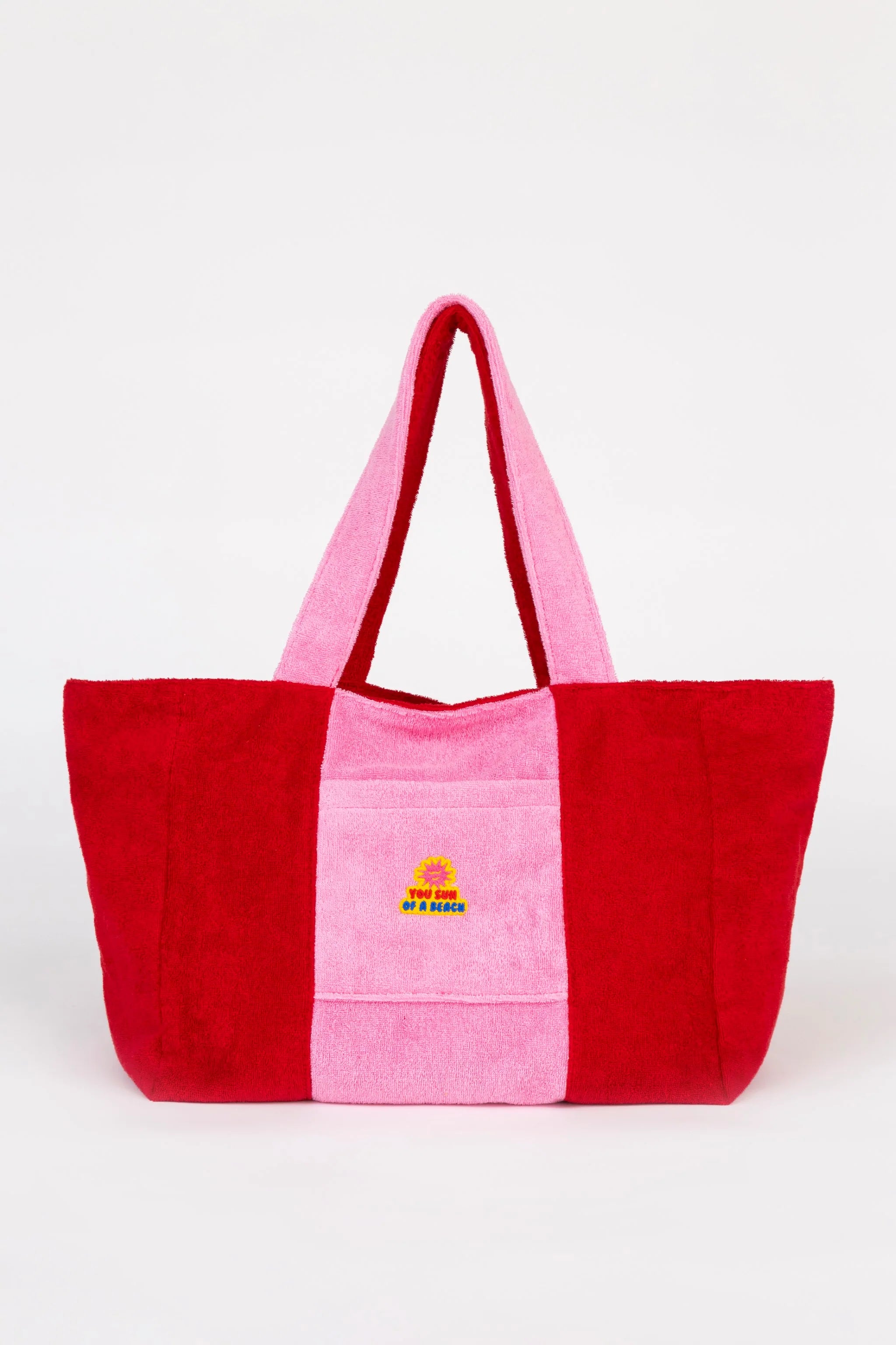 Red and pink tote bag with a small logo on a white background