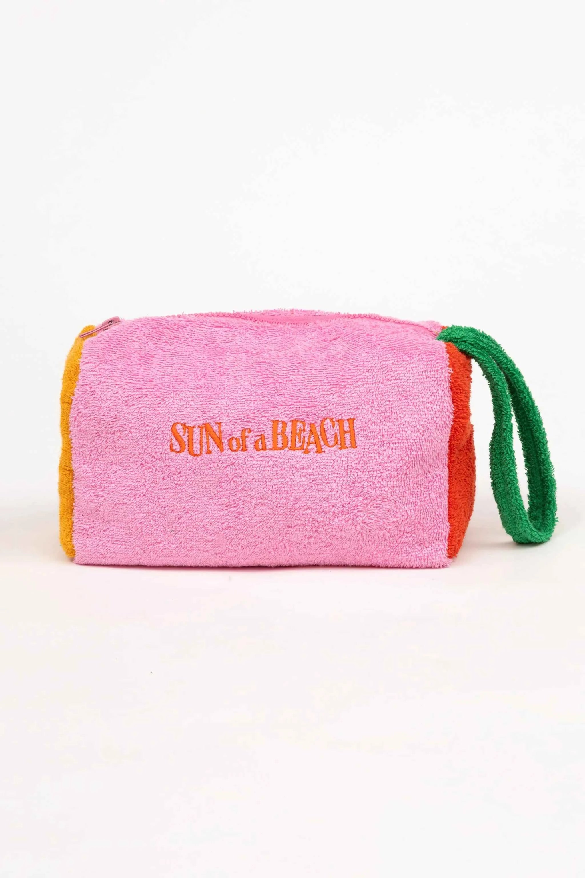 Pink and orange beach towel with 'Sun of a Beach' text on a white background
