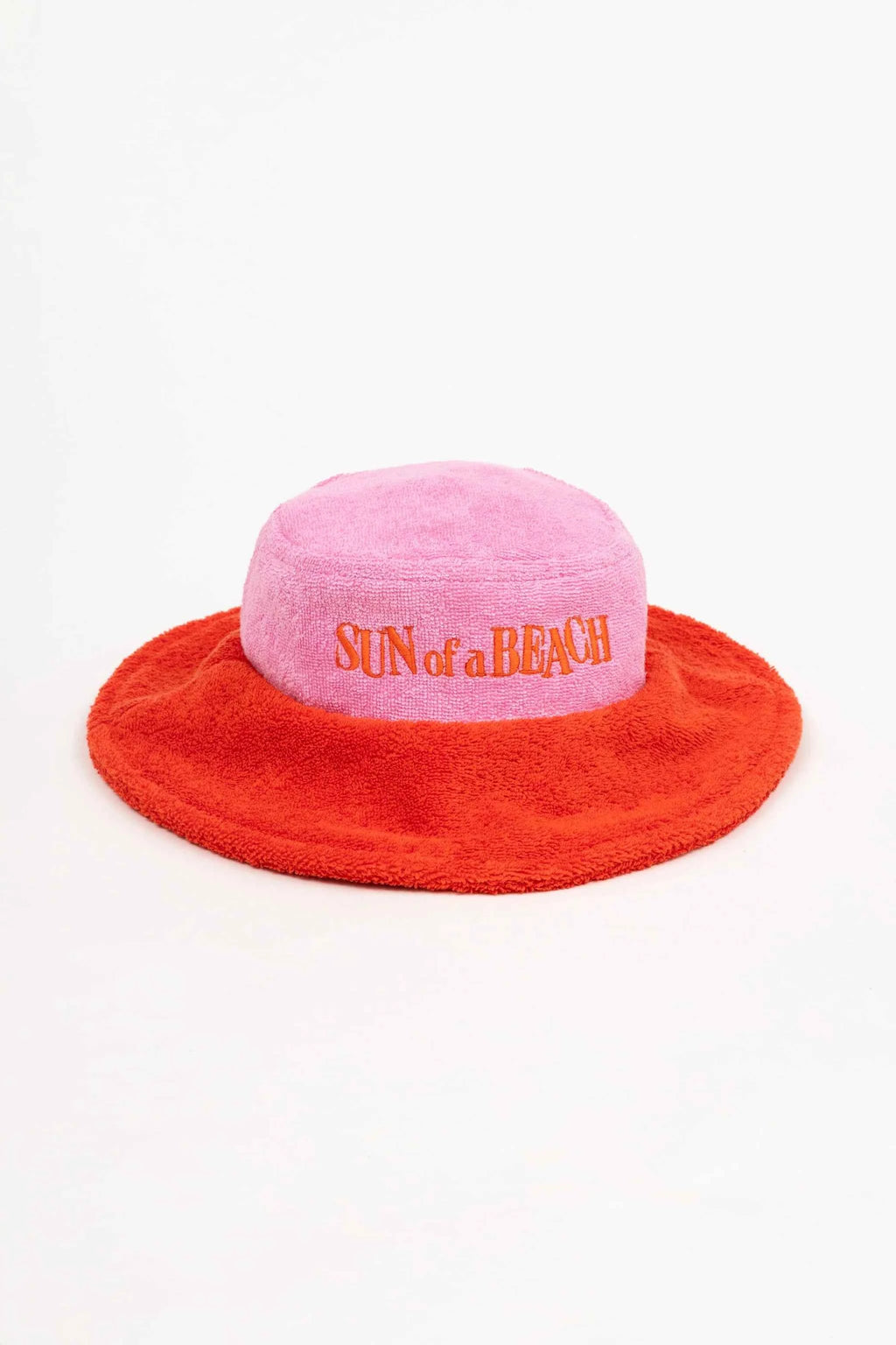 Pink and red bucket hat with 'Sun of a Beach' text on a white background