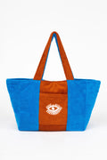 Blue and brown tote bag with a logo on a white background
