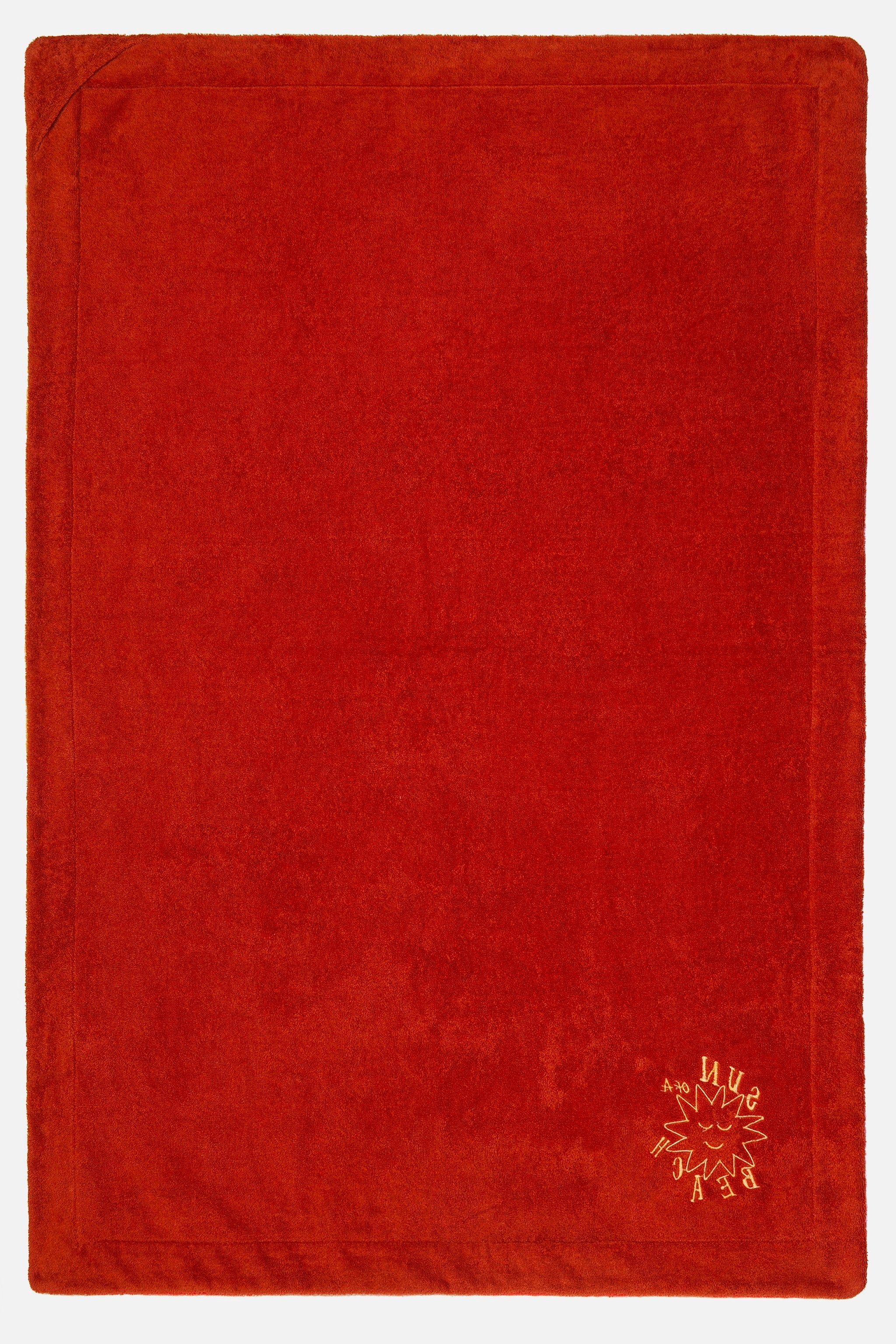 Red textured fabric with a small logo in the corner on a white background