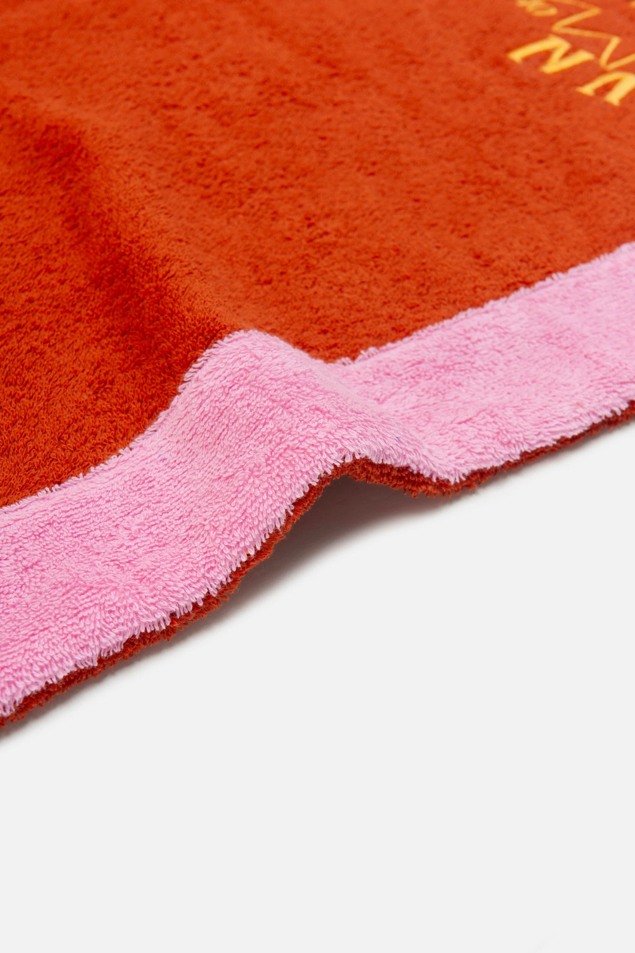 Close-up of a red and pink textured product corner