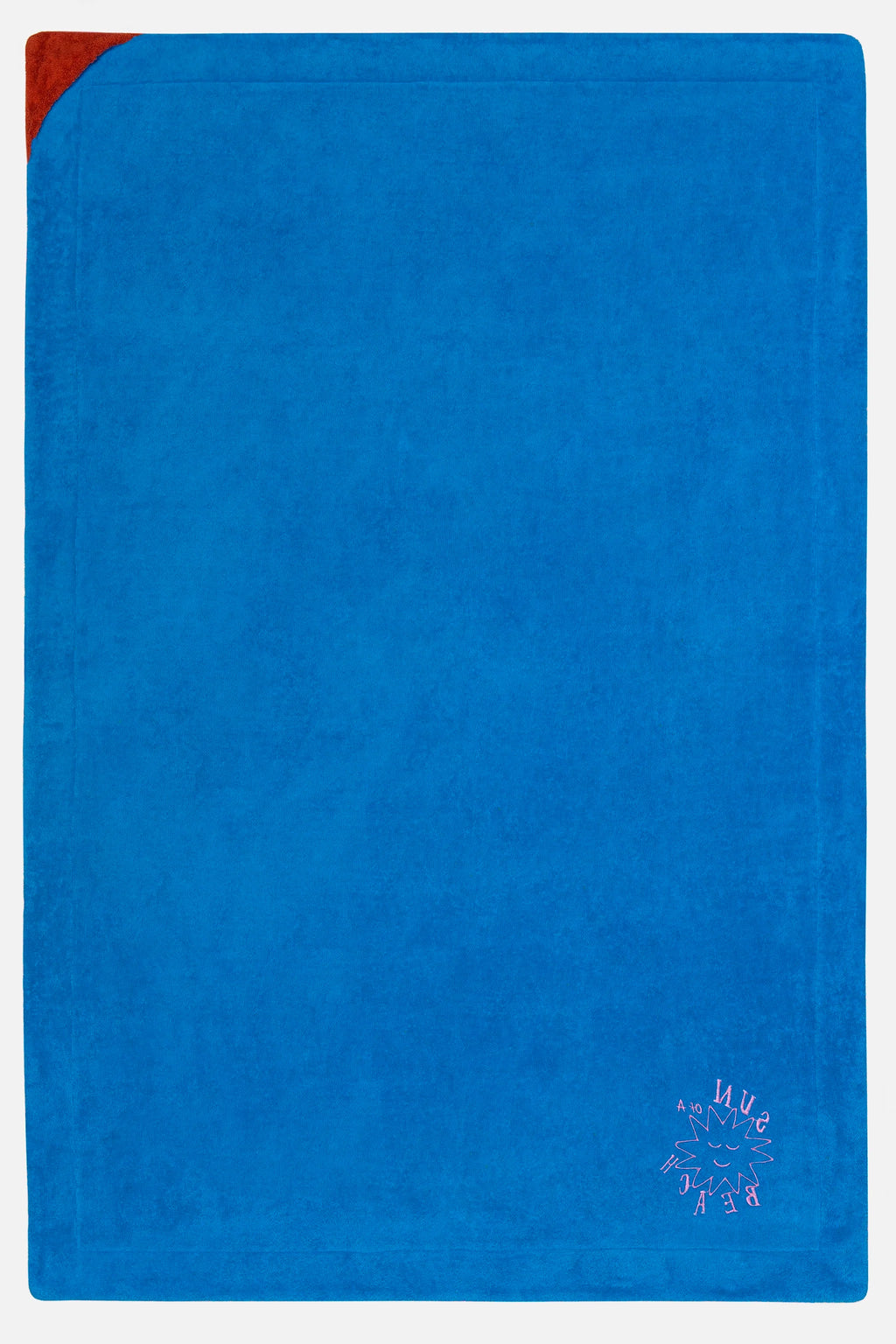 Blue towel with a red corner on a white background