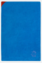 Blue towel with a red corner on a white background