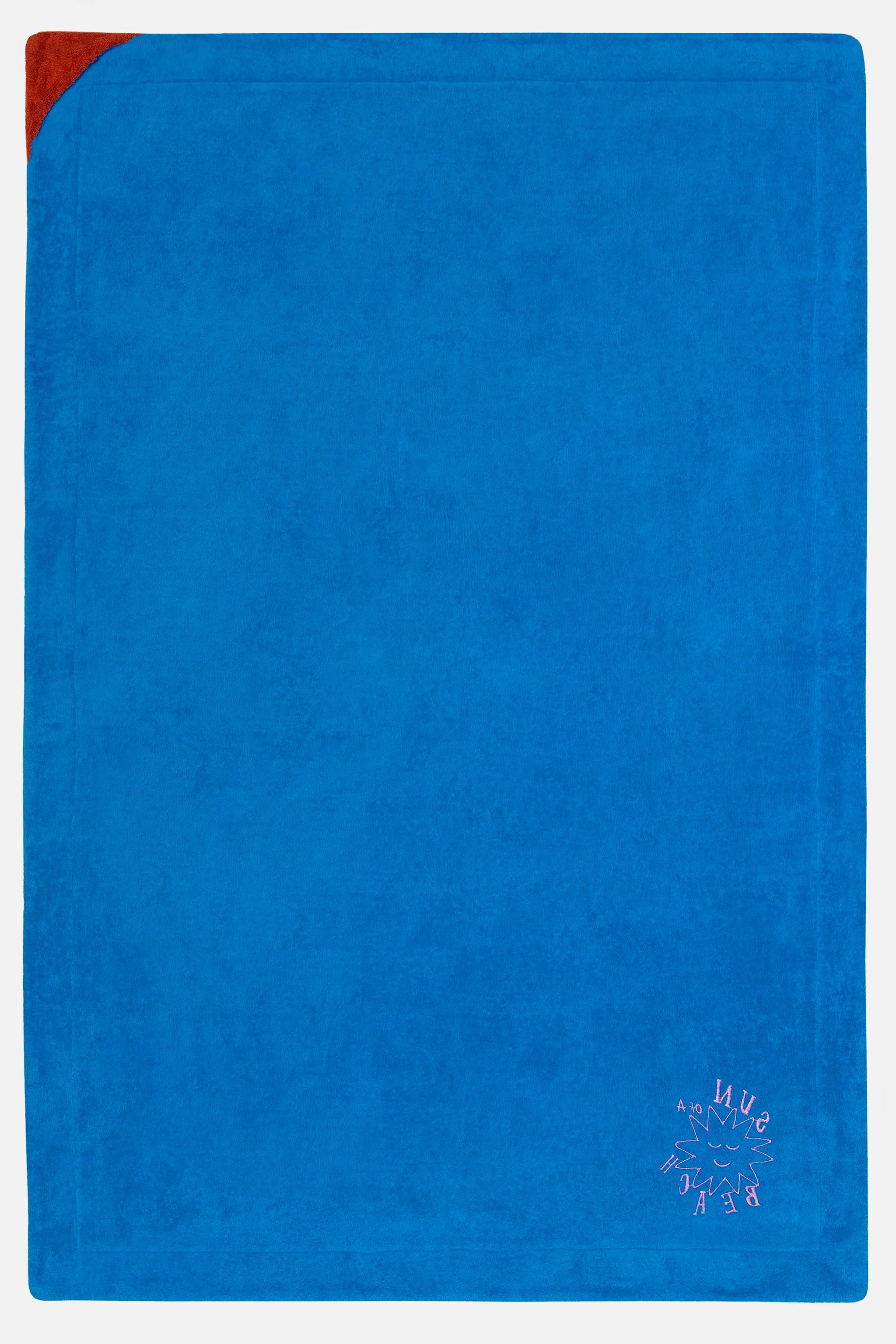 Blue towel with a red corner on a white background