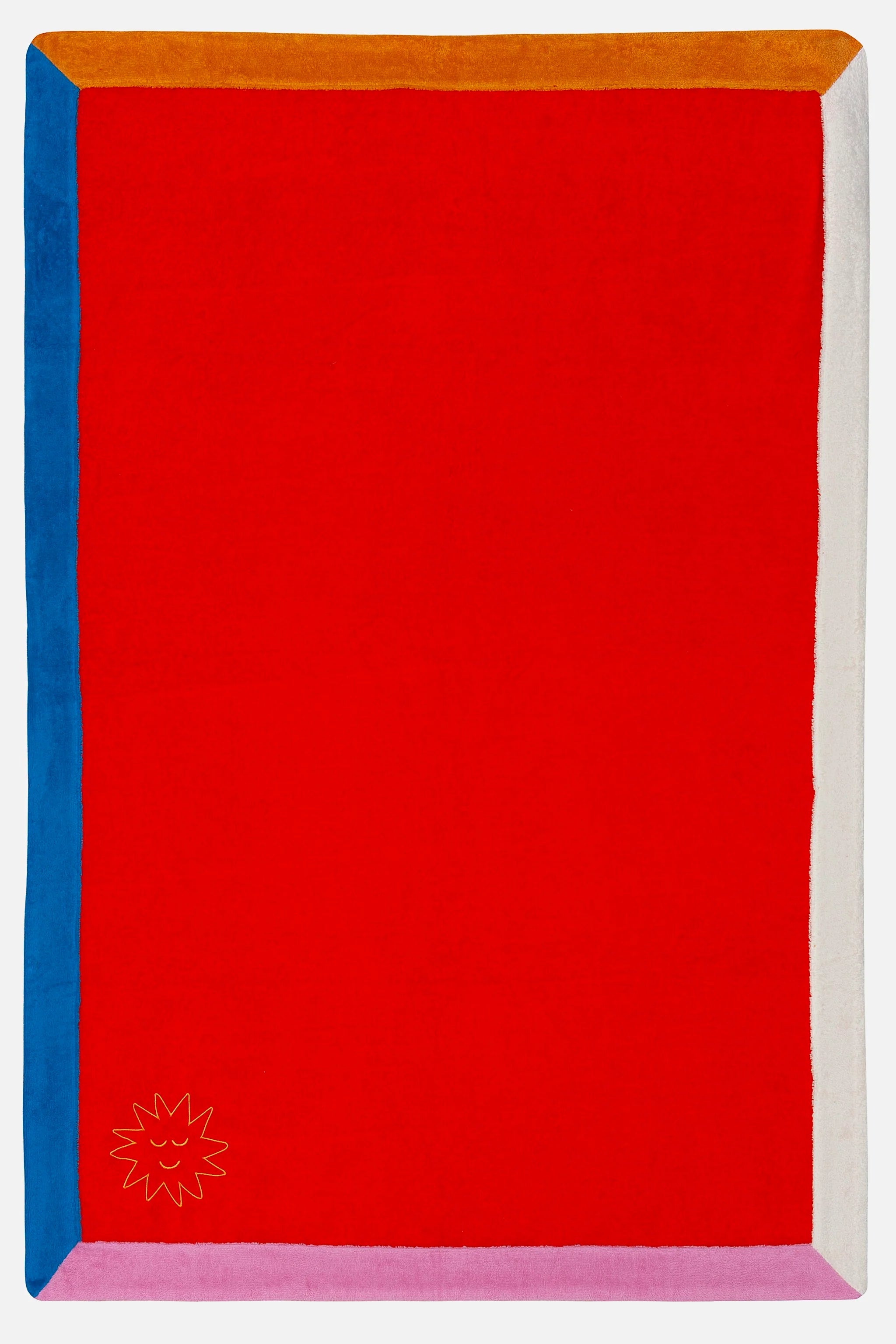 Red rectangular mat with colorful border and logo in the corner