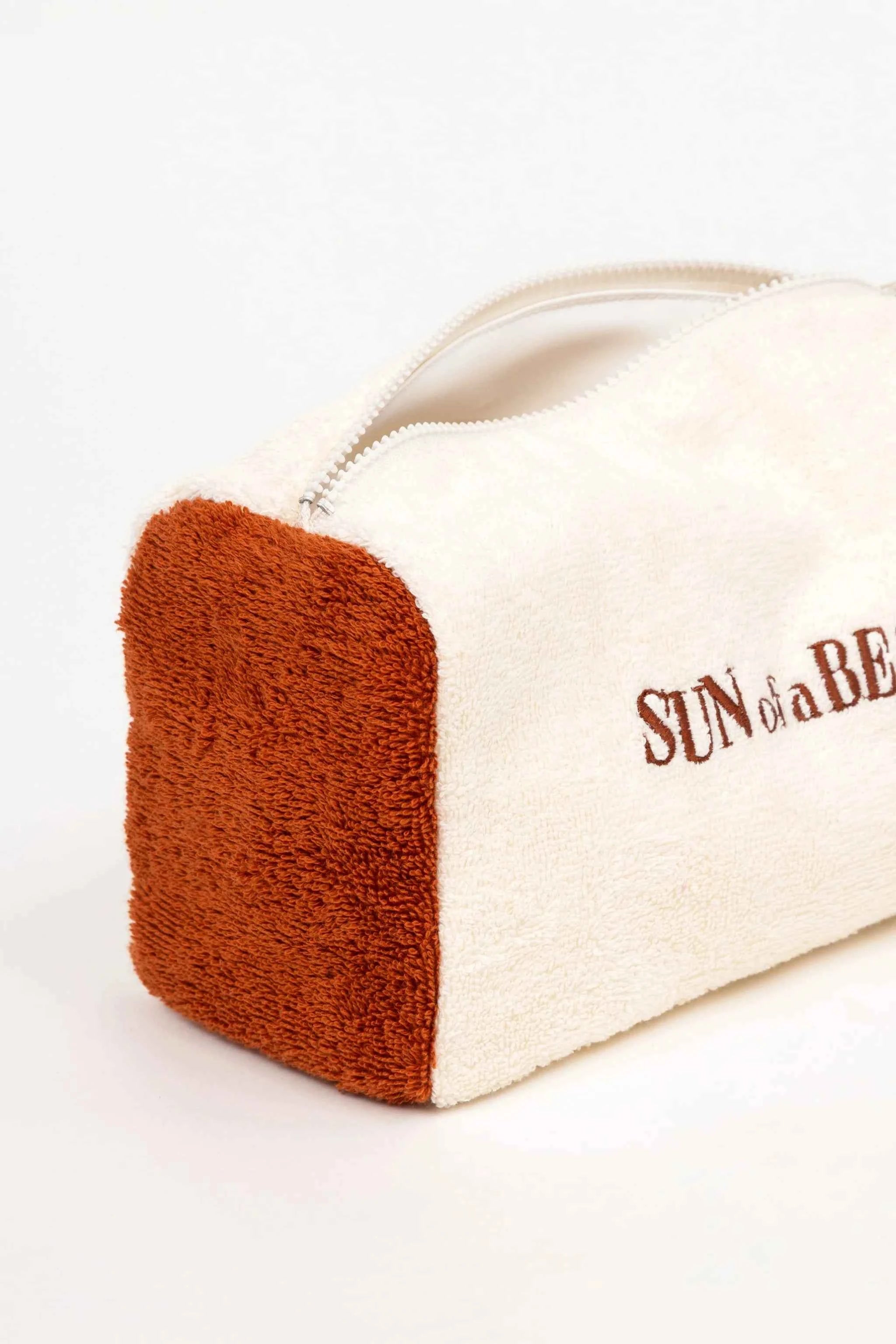 Canvas pouch with brown corner and 'Sun of a Bee' text on a white background