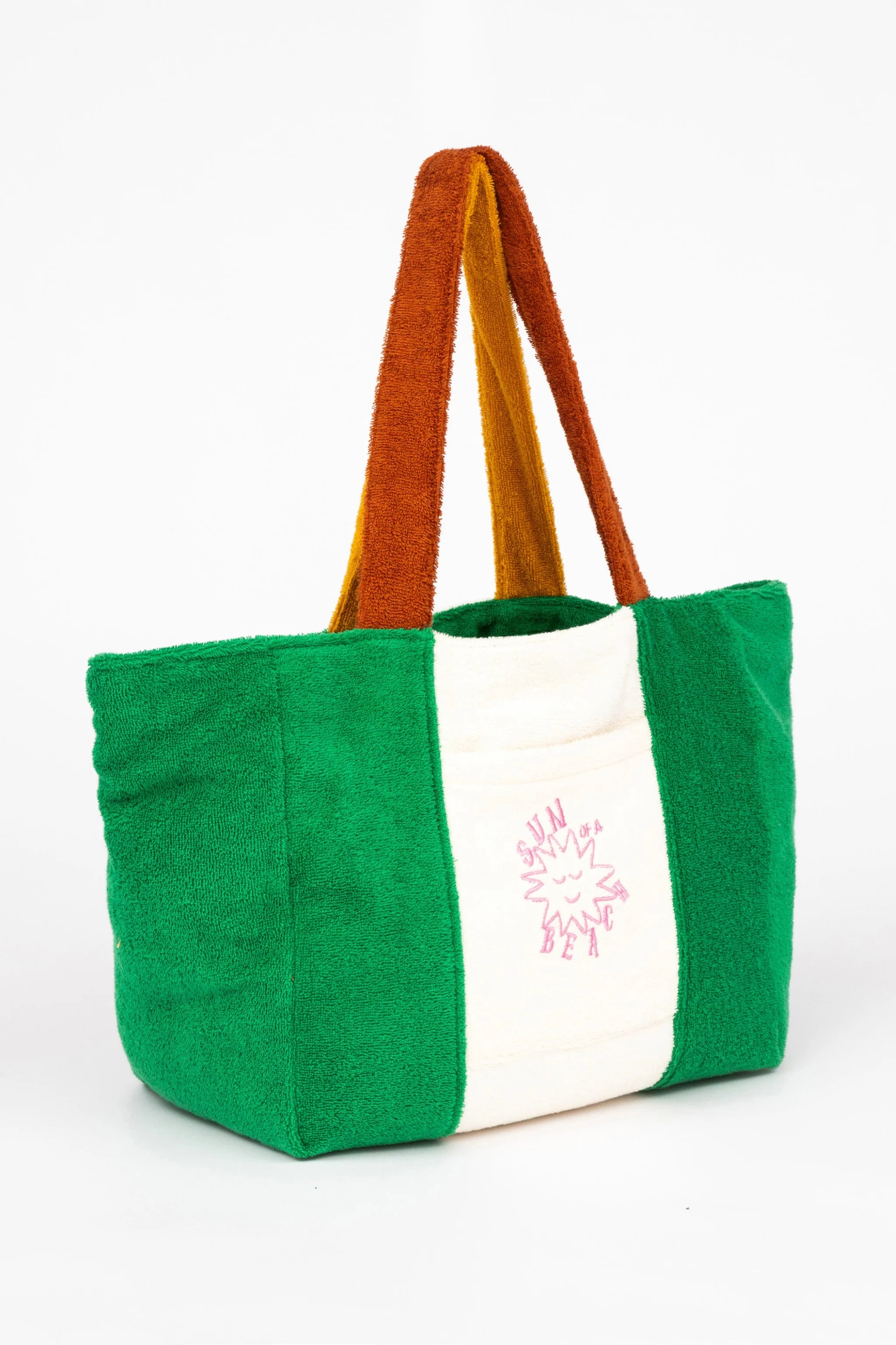 Tote bag with green body, white front panel, and brown handle on a white background