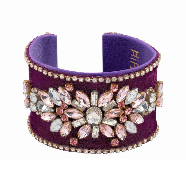Purple cuff bracelet with crystal embellishments on a white background