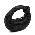 A black textured shoulder bag covered in small rhinestones, featuring a knotted top handle and a silver zipper closure, shown on a plain white background.