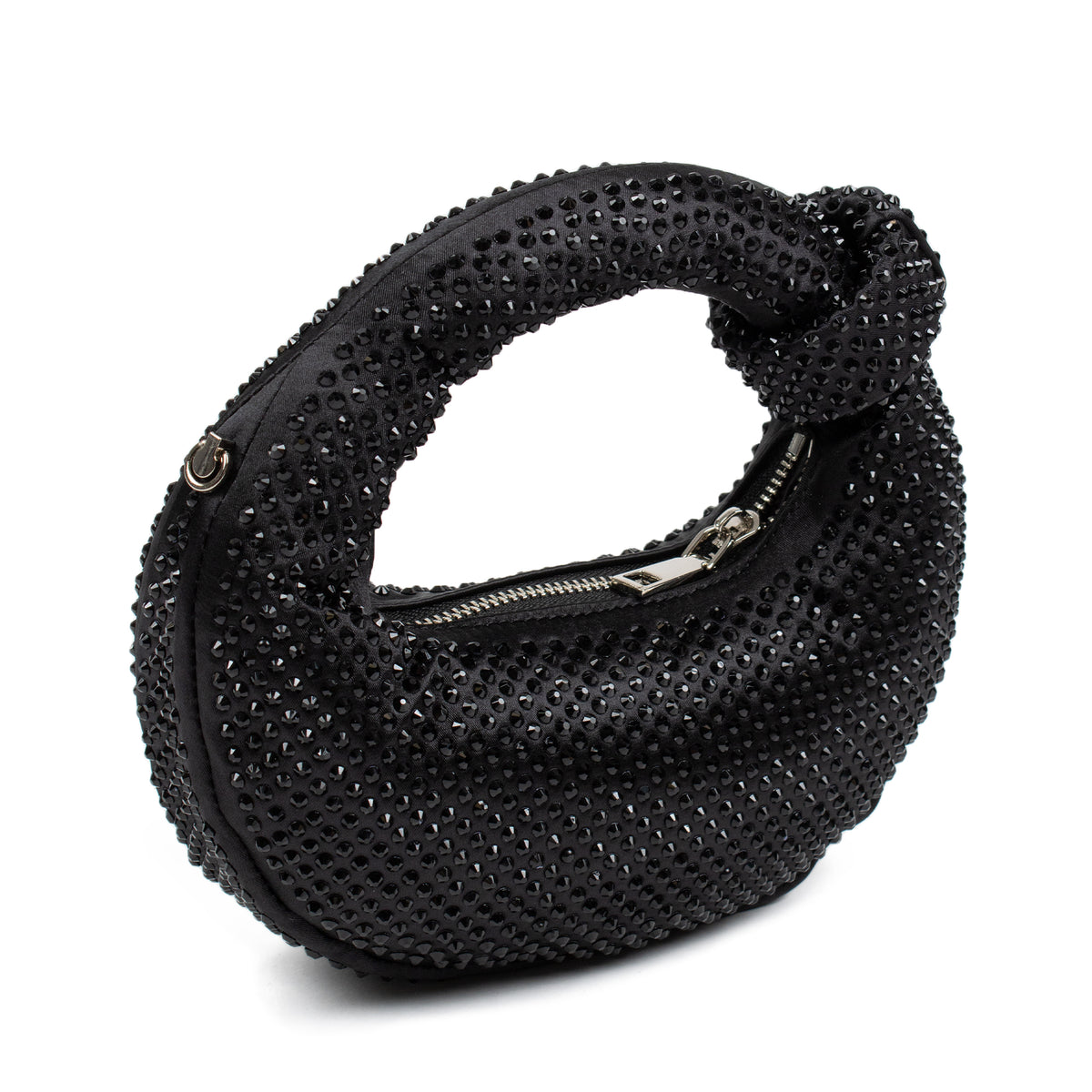 A black textured shoulder bag covered in small rhinestones, featuring a knotted top handle and a silver zipper closure, shown on a plain white background.