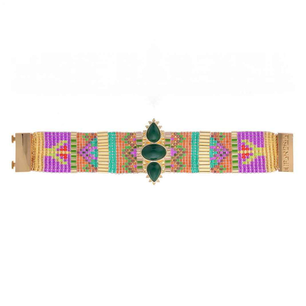 Colorful woven bracelet with a gold clasp on a white background