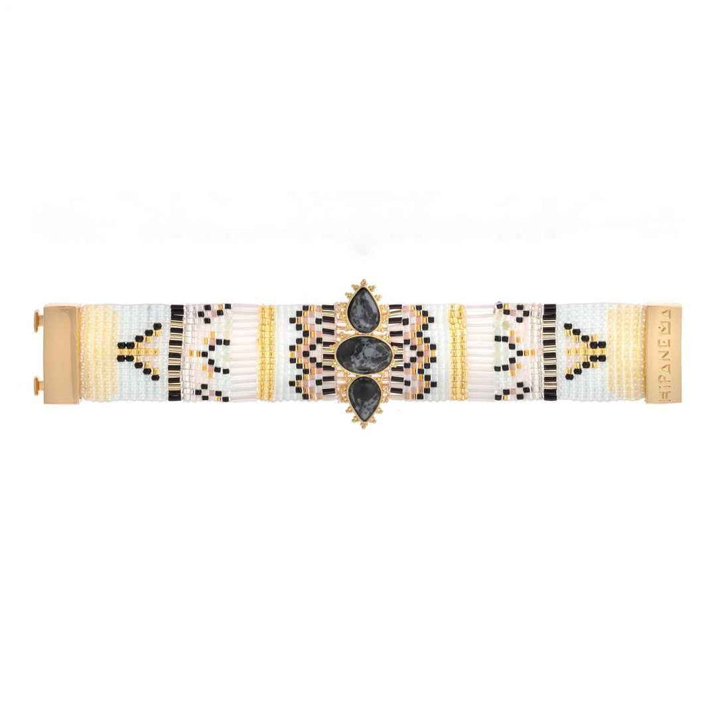 Bracelet with geometric pattern and black stones on a white background