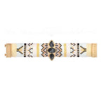 Bracelet with geometric pattern and black stones on a white background