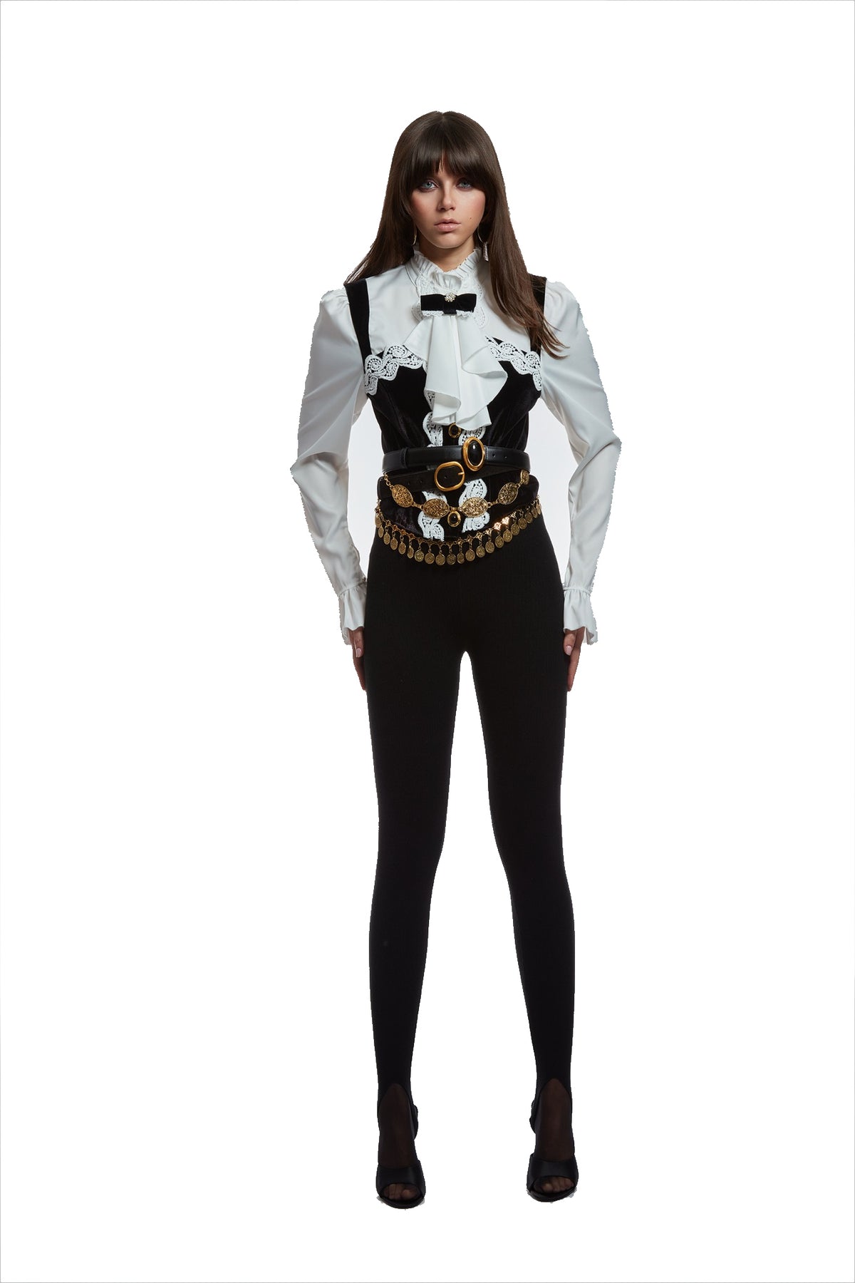 A model wearing a gothic western-style outfit consisting of a white long-sleeve blouse with lace trim and a black vest, a wide black belt with gold hardware and a black bow tie, paired with black pants and black heels, on a solid white background.