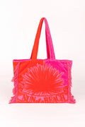 Neon pink and orange tote bag with a sun design on a white background