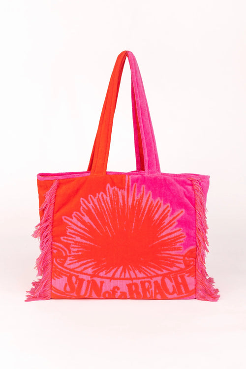 Neon pink and orange tote bag with a sun design on a white background