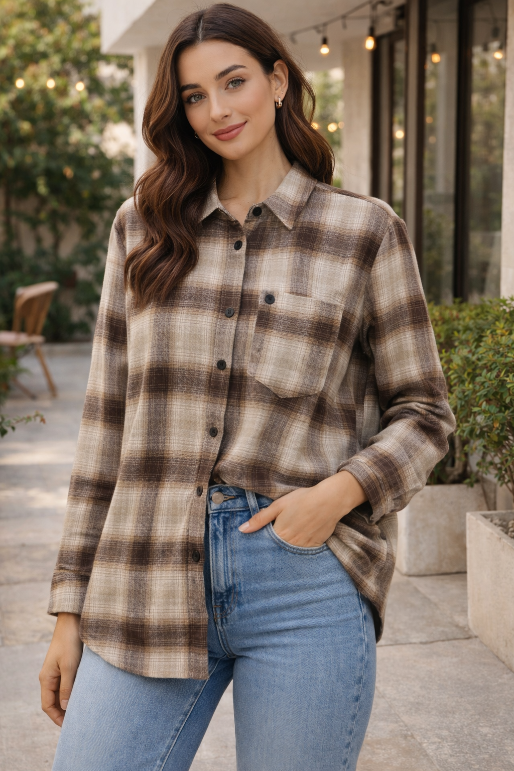 Woman wearing a plaid shirt and jeans outdoors