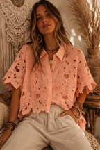 Woman wearing a pink crochet top with a bohemian background