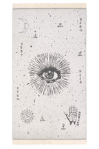 Decorative wall tapestry with celestial designs and symbols on a neutral background