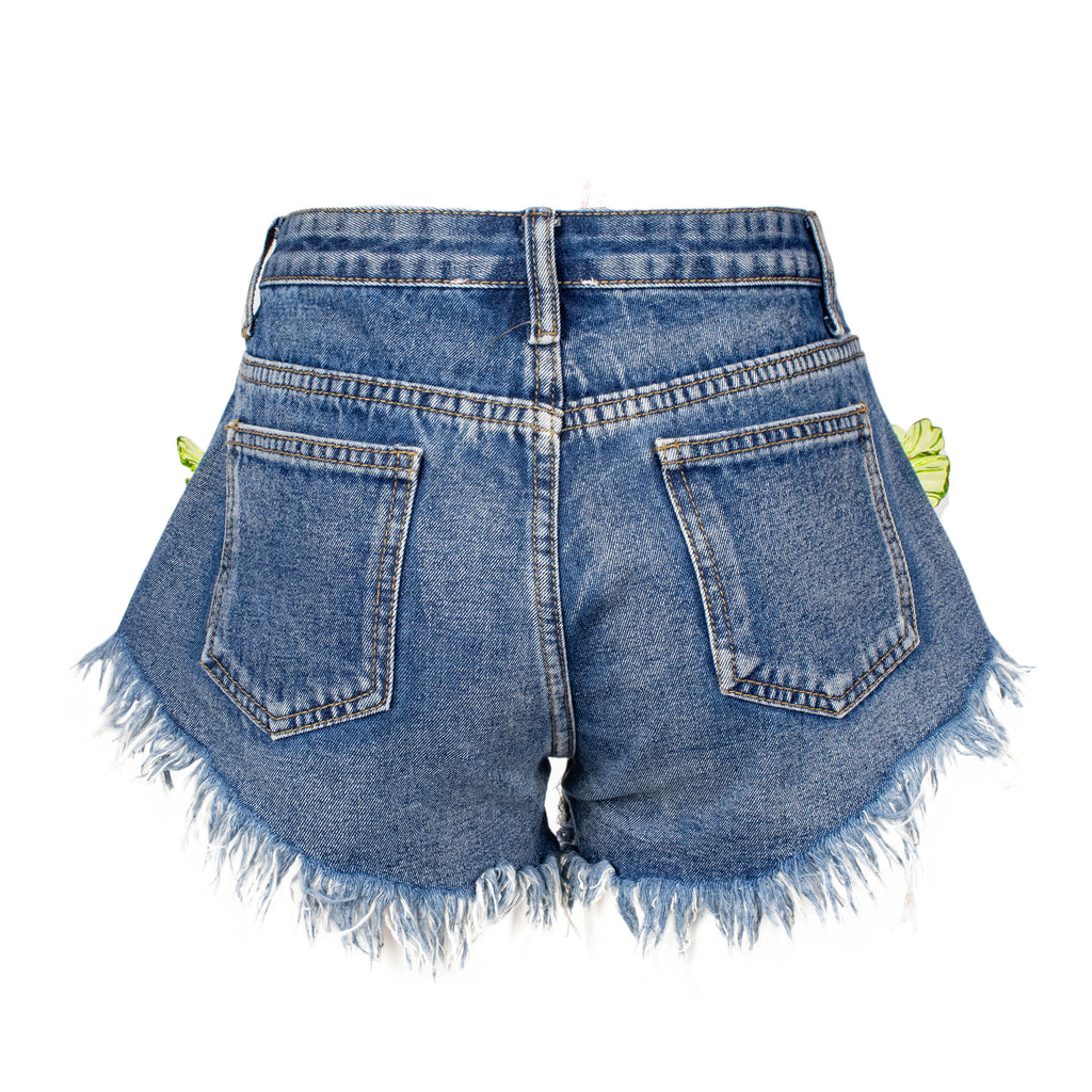 Blue denim shorts with frayed edges on a white background