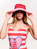 Woman wearing a red and white striped tank top with a heart design and a matching bucket hat.