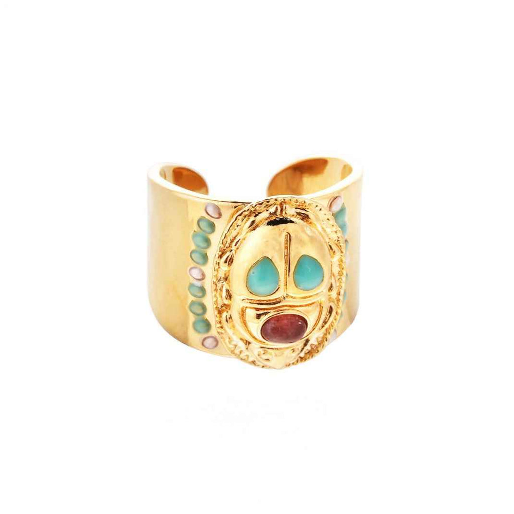 Gold ring with colorful stones on a white background