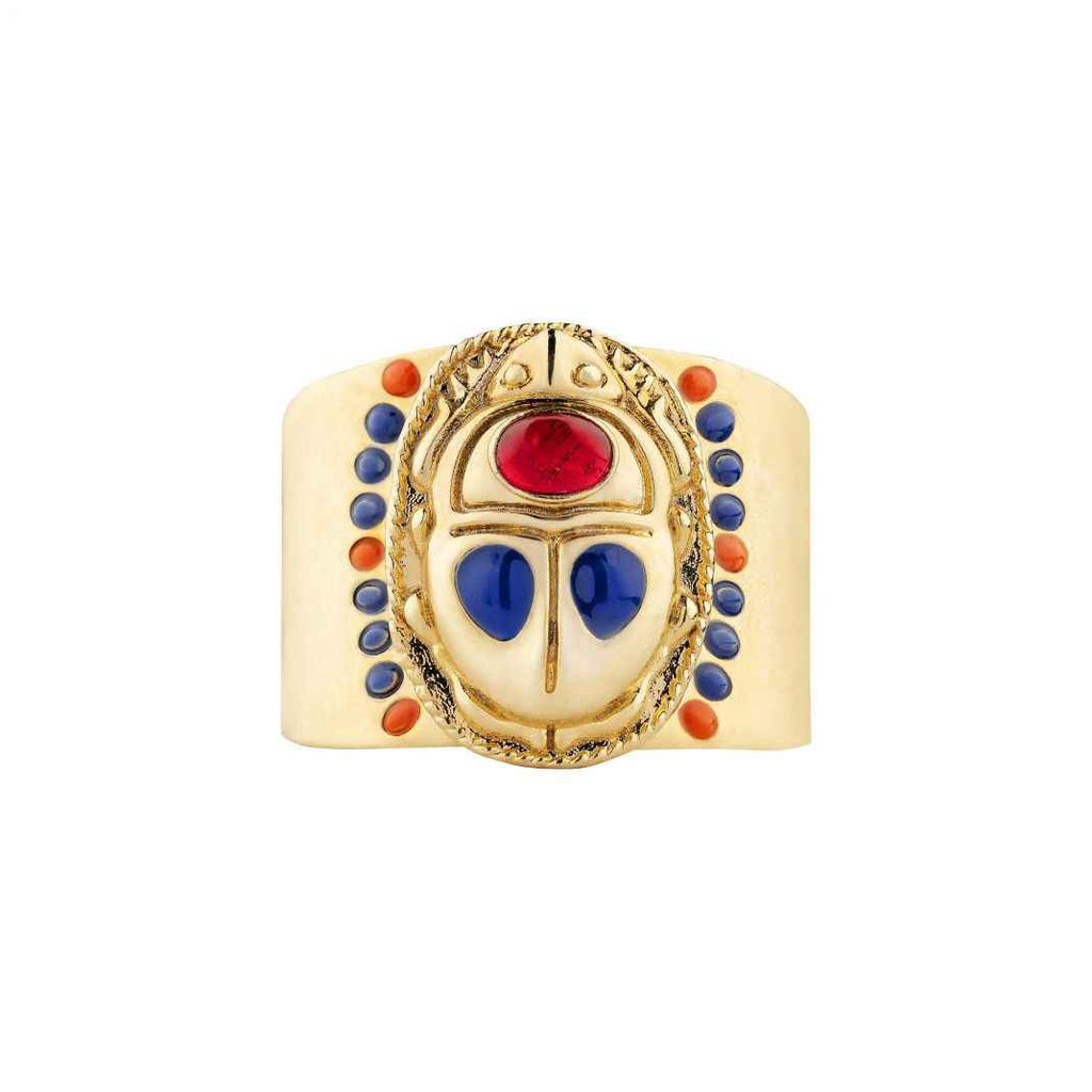 Gold ring with colorful gemstones on a white background