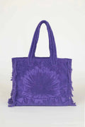 Purple tie-dye tote bag with fringes on a white background