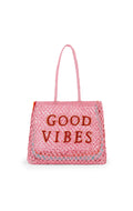Pink tote bag with 'Good Vibes' text on a white background