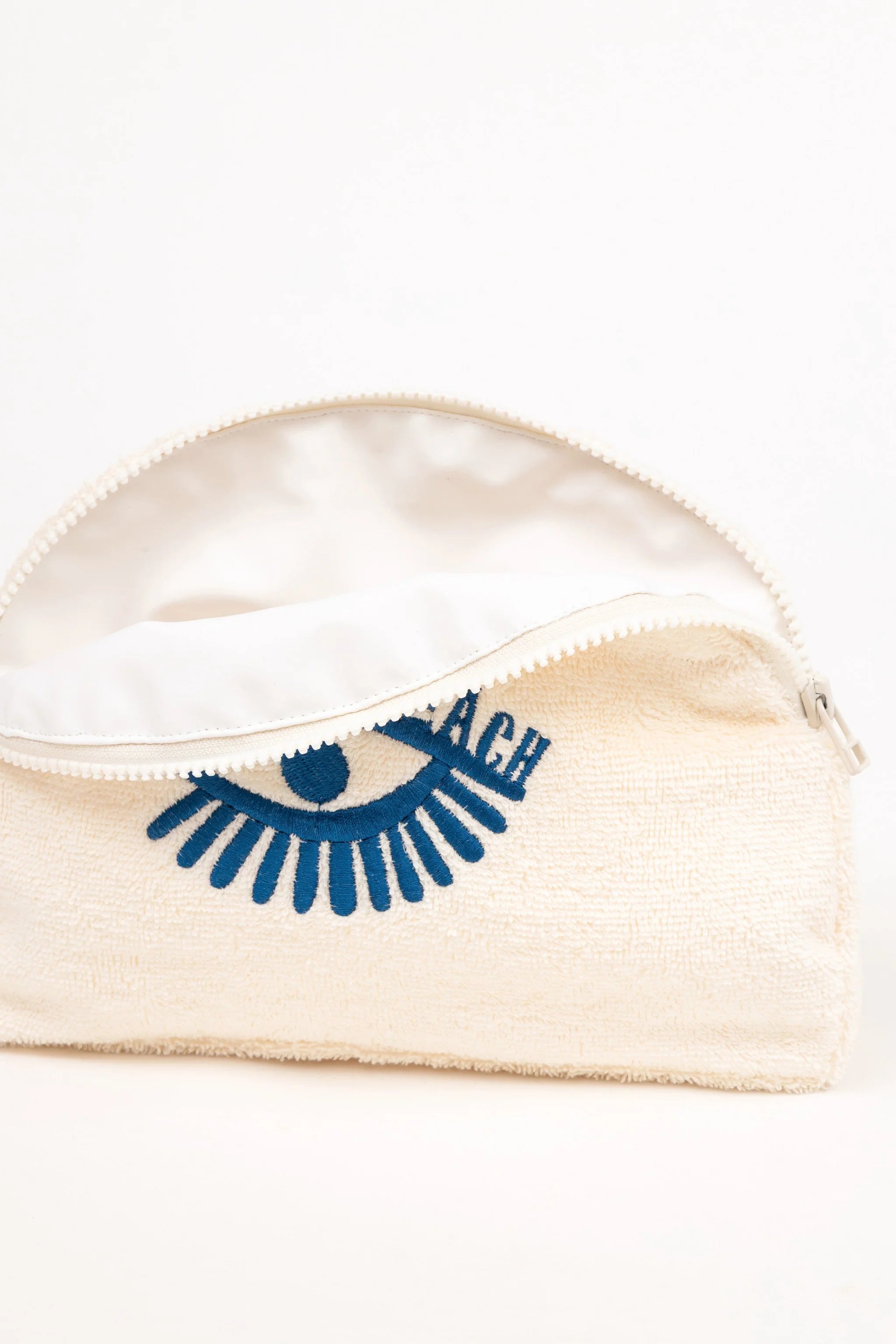Clear pouch with beige lining and blue logo on a white background