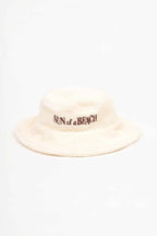 Beige bucket hat with 'Sun of a Beach' text on a white background
