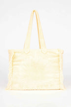 Yellow tote bag on a white background