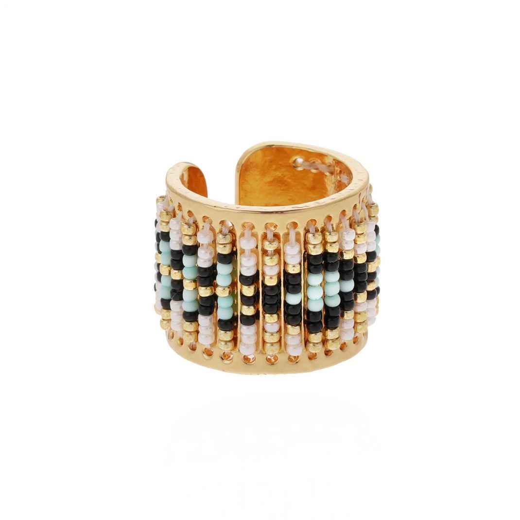Gold beaded ring with multicolor beads on a white background