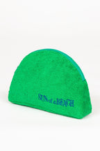 Green towel with 'Sun of a Beach' text on a white background