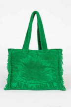 Green tie-dye tote bag with fringes on a white background