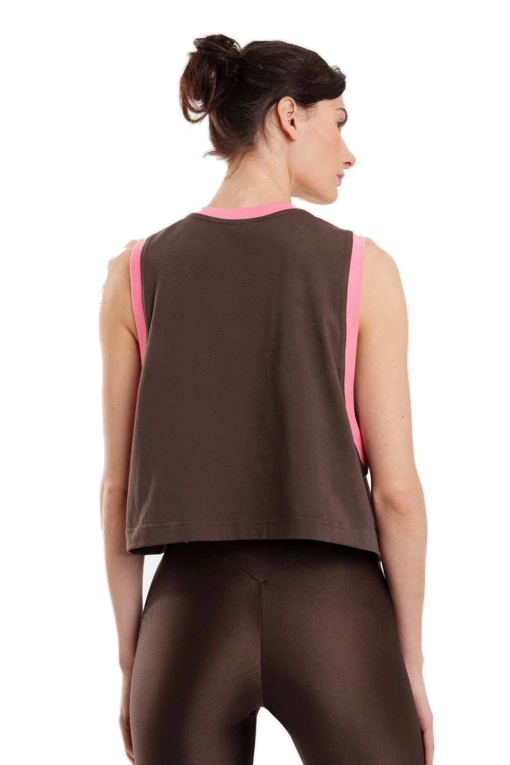 A woman shown from the back wearing a dark brown sleeveless crop top with bright pink trim and matching dark brown leggings against a plain white background.