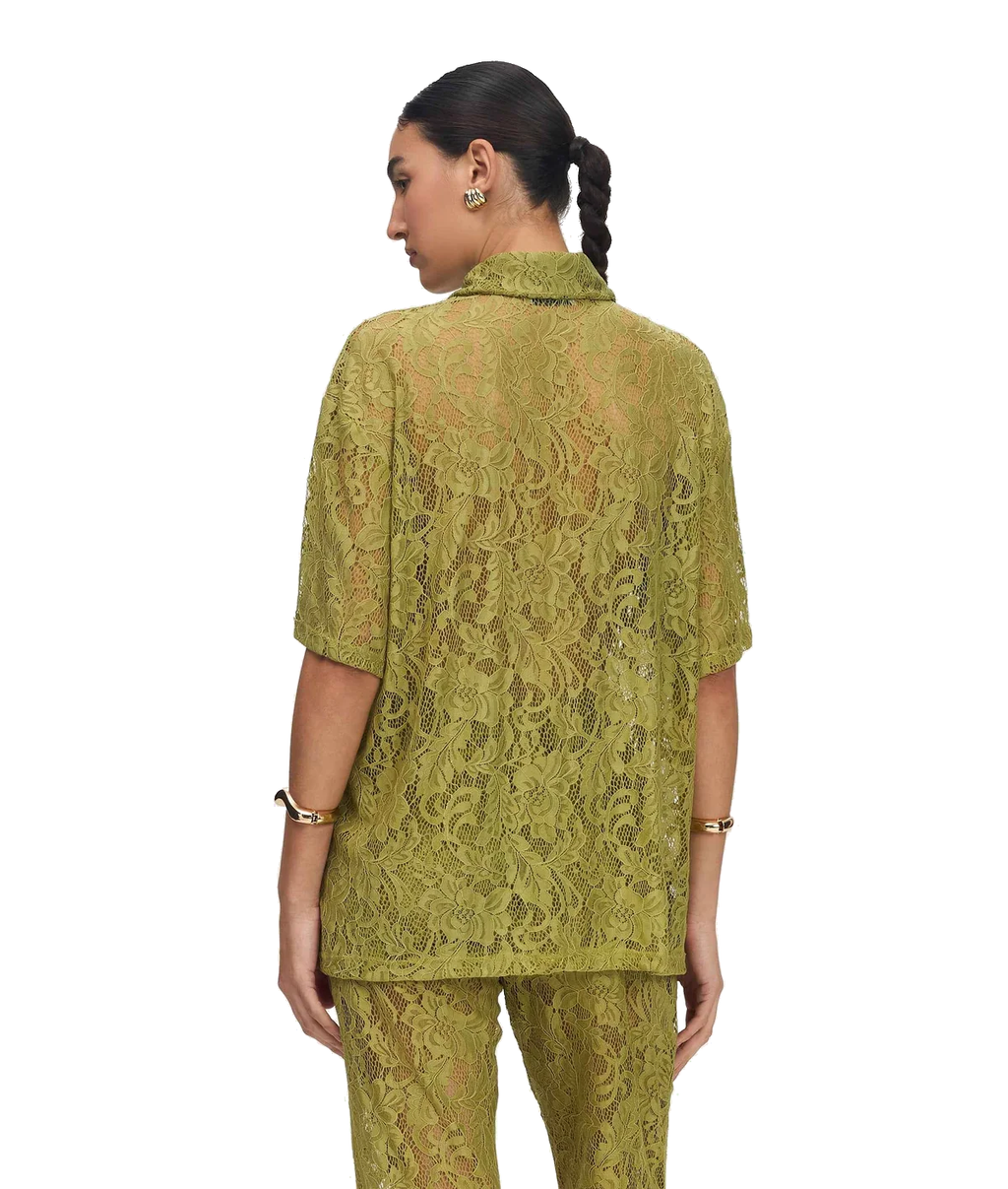 A woman shown from the back wearing a matching olive green lace short-sleeve top and pants set against a plain white background.