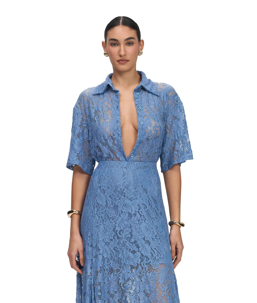 A woman modeling a light blue lace midi dress with a deep V-neckline, short sleeves, and a fitted waist against a plain white background.